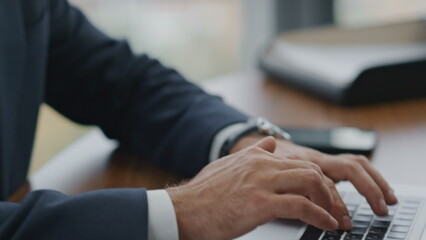 Financial analyst typing reports on laptop at office close up. Manager working.