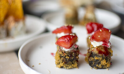 Fried sushi with strawberries on the top