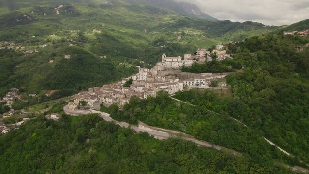 Little typical village up a mountain and green valley in the Abruzzo region of Italy