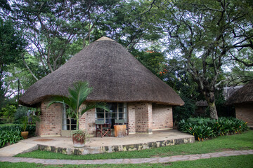 Fototapeta na wymiar Weekend summer house in tropical country side, nearby Lake Chivero, 1 hour drive from Harare, capital of Zimbabwe, made in African Tukul house style
