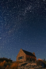 Church of Good Sherpard, New Zealand , under starry night with spiral star trails 
