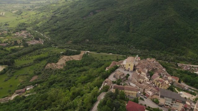 Little typical village up a mountain and green valley in the Abruzzo region of Italy