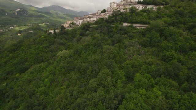 Little typical village up a mountain and green valley in the Abruzzo region of Italy