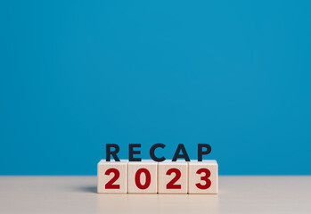 2023 Recap economy, business, financial concept. RECAP 2023 words on wooden cubes. Past performance...