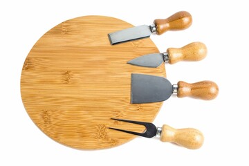 Round board and knives set isolated on a white background