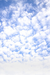 Vertical Blue sky background with clouds pattern