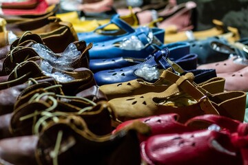 Closeup of colorful shoes for kids in a market