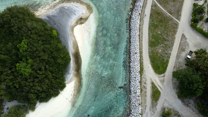 Aerial view of a coastline with crystal clear water