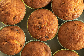 Homemade muffins on a tray in silicone molds.