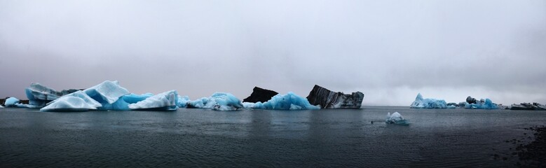 Panoramic view of the icebergs on the water's surface. Iceland.