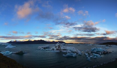 View of the icebergs on the water's surface. Beautiful glacial lake at sunset. Iceland.