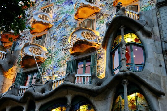 Closeup shot of the colorful balconies of Casa Batllo  in Barcelona in the evening