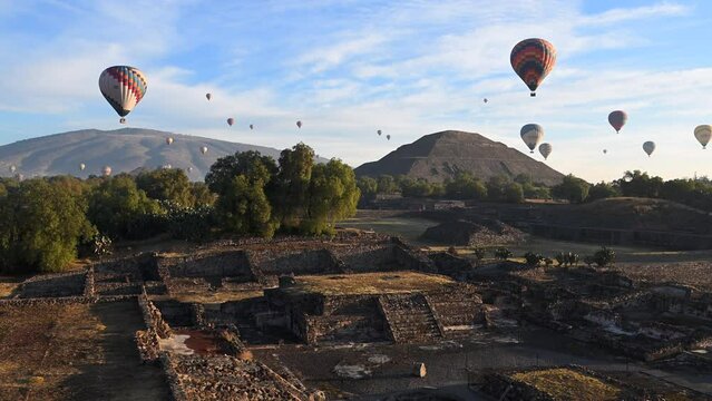 Hot air balloons soar over the ancient Pyramids of the Moon and Sun in Teotihuacan, Mexico.⁣ The ceremonial site holds thousands of homes and temples that are comparable to the pyramids of Egypt.