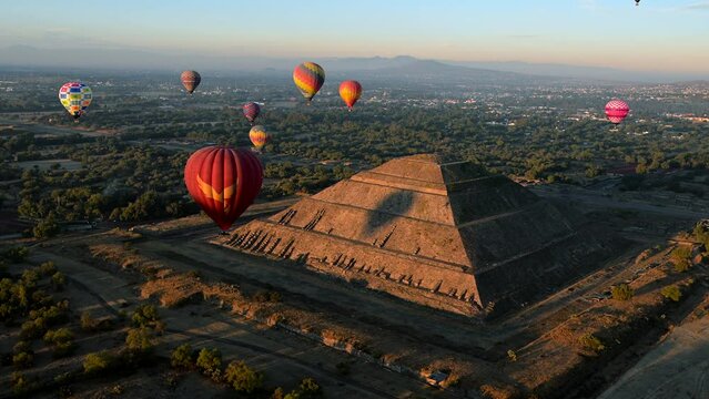 Sunrise over the Pyramids of the Moon and Sun in Teotihuacan, Mexico.⁣ Hot air balloon rides are popular at the ceremonial site that is comparable in size to the pyramids of Egypt.
