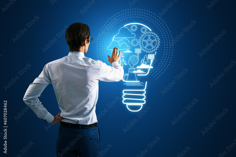 Poster back view of businessman hand using abstract digital lamp hologram on blue background. start up, ent