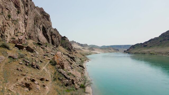 Drone shot of river Ili and spring steppe in Kazakhstan