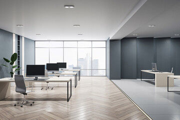 Front view of modern empty office interior with concrete floor, dark walls and desks with computers, window with city view and furniture. Business background and workspace concept, 3D Rendering