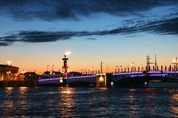 Fototapeta na wymiar Magical Sankt Petersburg city illuminated at night and the Neva river