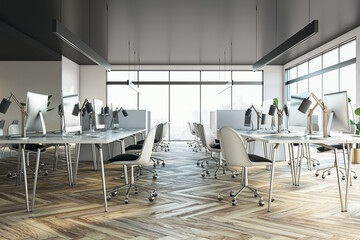 Modern coworking office interior with furniture, equipment and panoramic window with city view and daylight. 3D Rendering.