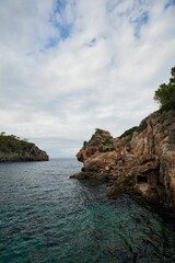Aerial view of sea surrounded by cliffs