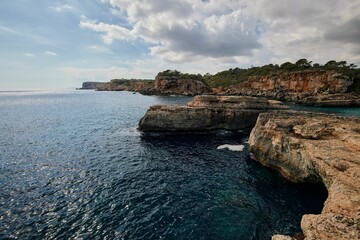 Aerial view of sea surrounded by cliffs