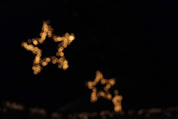 Bokeh festival lights at night as decorations for streets