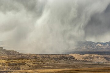 View of cliffs during the sandstorm. Earth forest landform in Zanda County, Tibet, China.