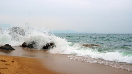 Big waves hitting the rocks in the shore