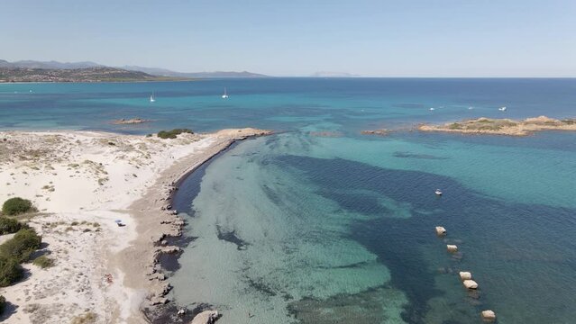 Drone shot of Isola Rossa beach with blue sea