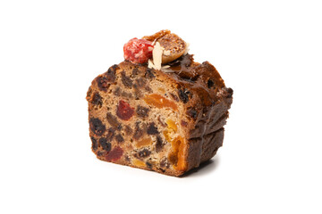 A cake with dried fruits, raisins almonds, dried strawberry.