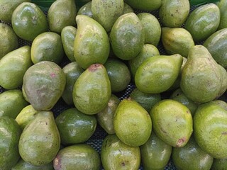 avocados in a market stall, close-up shot, horizontal