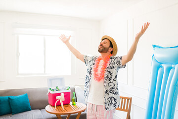 Carefree happy mid adult man relaxing in his summer staycations