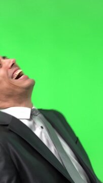 Rebellious and undisciplined employee in a suit laughing nonstop