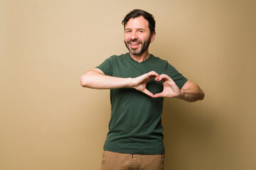 Happy mid-adult man in his 40s feeling in love