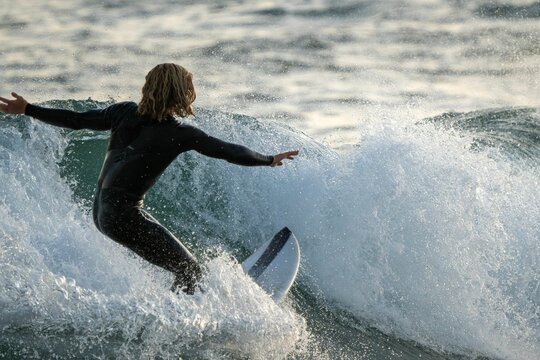 Closeup Shot Of A Surfer Catching A Wave At Bondi Beach, Australia