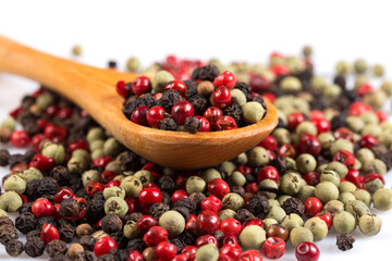 Pepper seasoning mix in wooden spoon