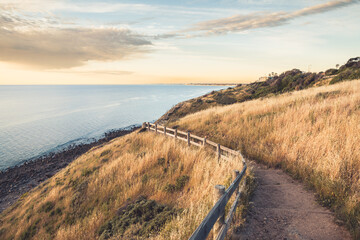 Marion to Hallett Cove Coastal Walking walking trail with sea view at sunset, South Australia