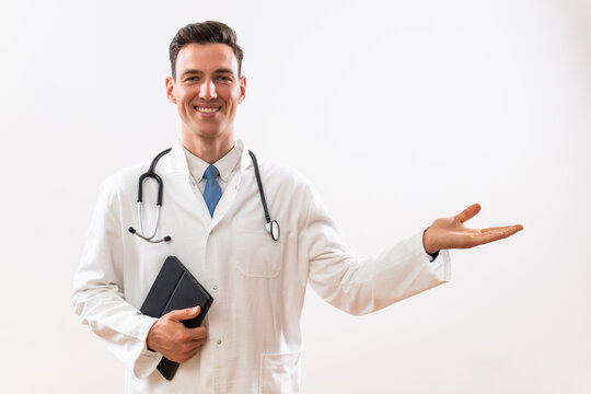 Image of  doctor showing welcome gesture. and holding digital tablet.