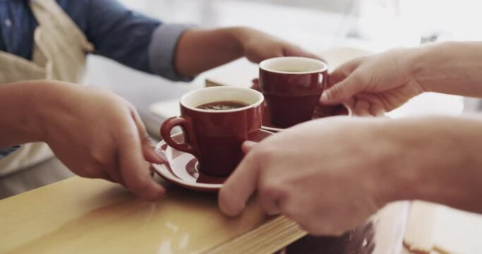 Closeup, barista and customer with coffee, service and giving espresso with caffeine, bistro and order. Zoom, employee and client with tea, luxury and cappuccino in a cafe, restaurant and collecting