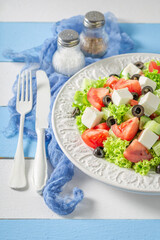 Diet and tasty Greek salad seasoned with olive oil.