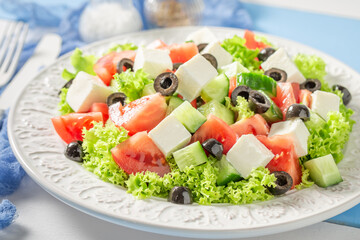 Full of vitamins Greek salad seasoned with olive oil.