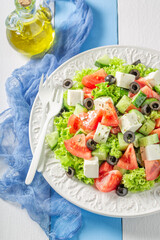 Diet and tasty Greek salad with tomatoes, cheese and lettuce.