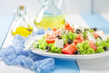 Fresh and healthy Greek salad seasoned with olive oil.