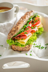 Delicious and homemade sandwich with cheese chive and ham.