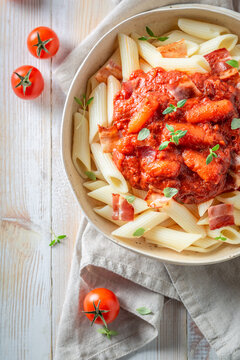Hot penne bolognese as a popular dish in Italy.