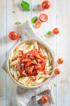 Homemade penne bolognese as a popular dish in Italy.