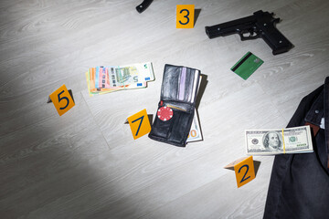Flat lay composition with evidences and crime scene markers on wooden background