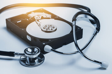 Hard disk drive and stethoscope. HDD diagnostic and repair