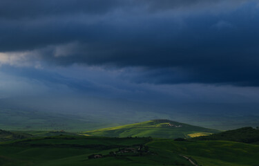 Fototapeta premium Tuscany fields in springtime, sunrise foggy mood,, Val d'Orca, Pienza region
