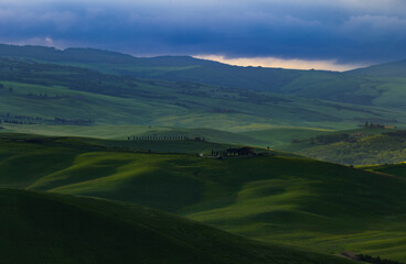 Fototapeta premium Tuscany fields in springtime, sunrise foggy mood,, Val d'Orca, Pienza region